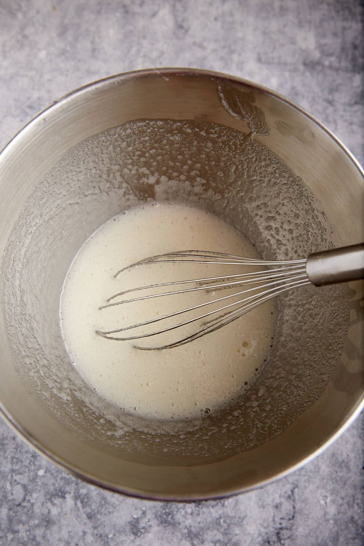 Egg whites simmered over hot water.