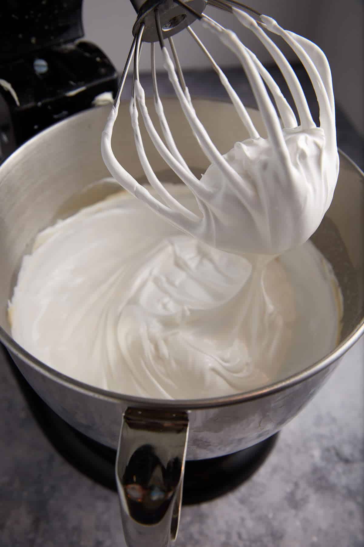 Egg whites whipped in a stand mixer.