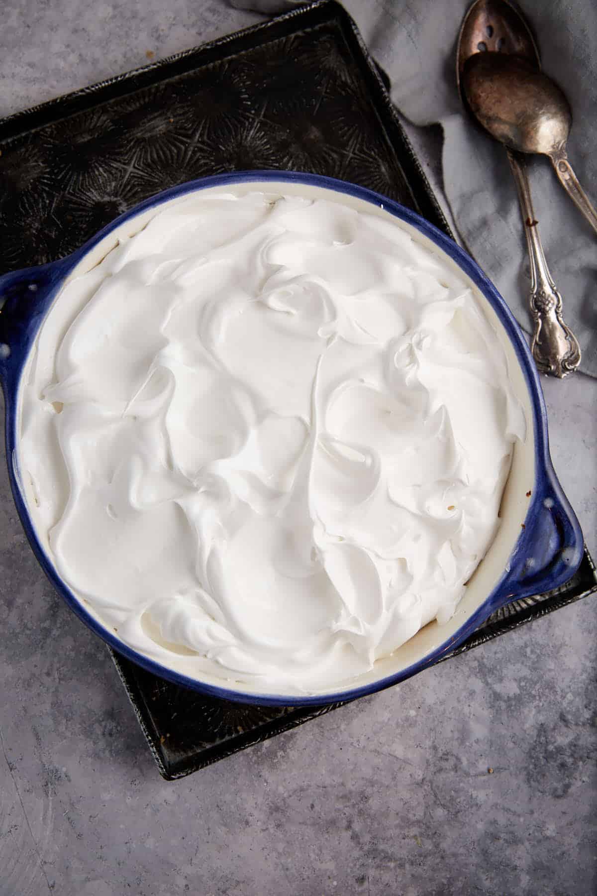 A marshmallow topping covering sweet potatoes,