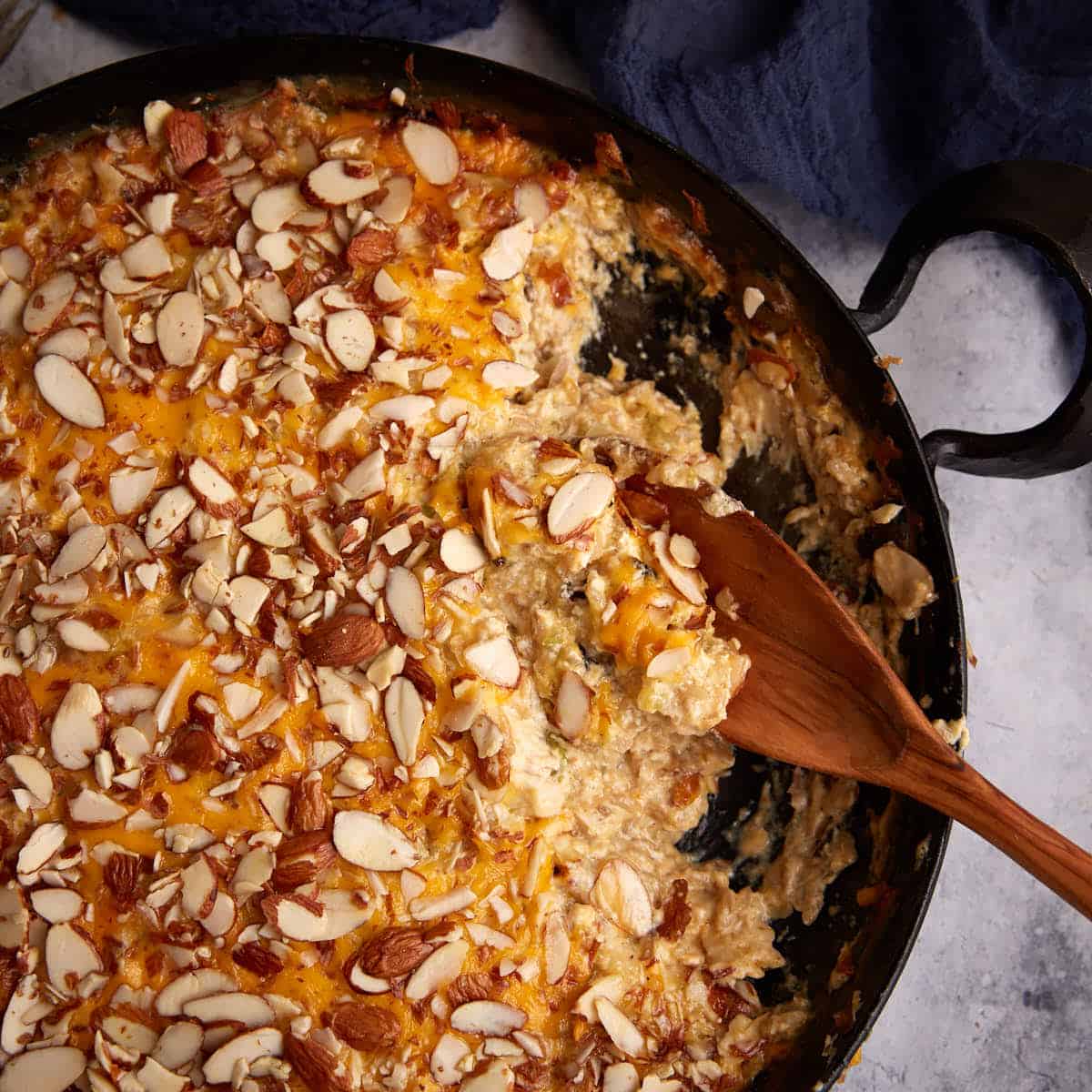 A skillet of baked chicken and wild rice casserole.