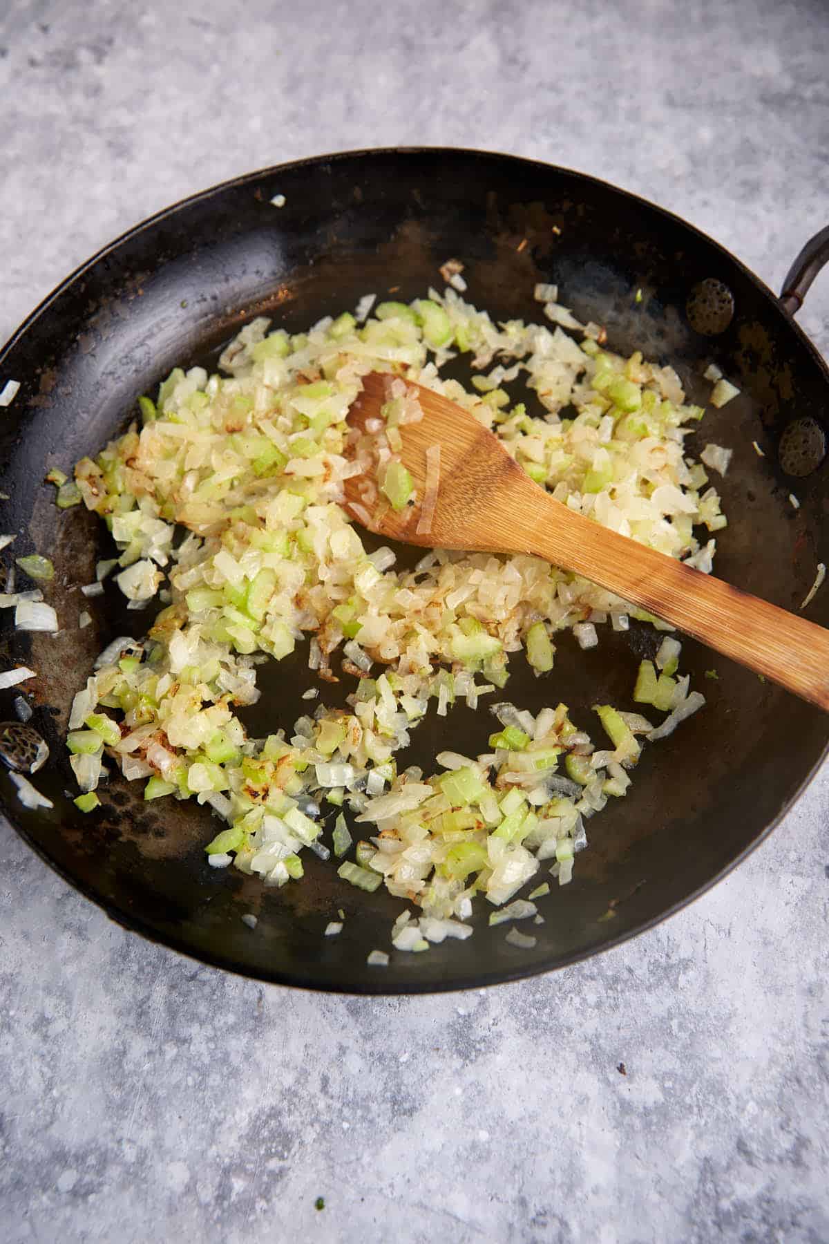 Celery and onions in a skillet.