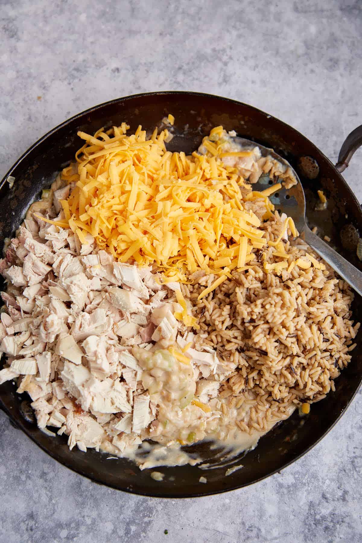 Chicken, cheese and rice added to the white sauce.