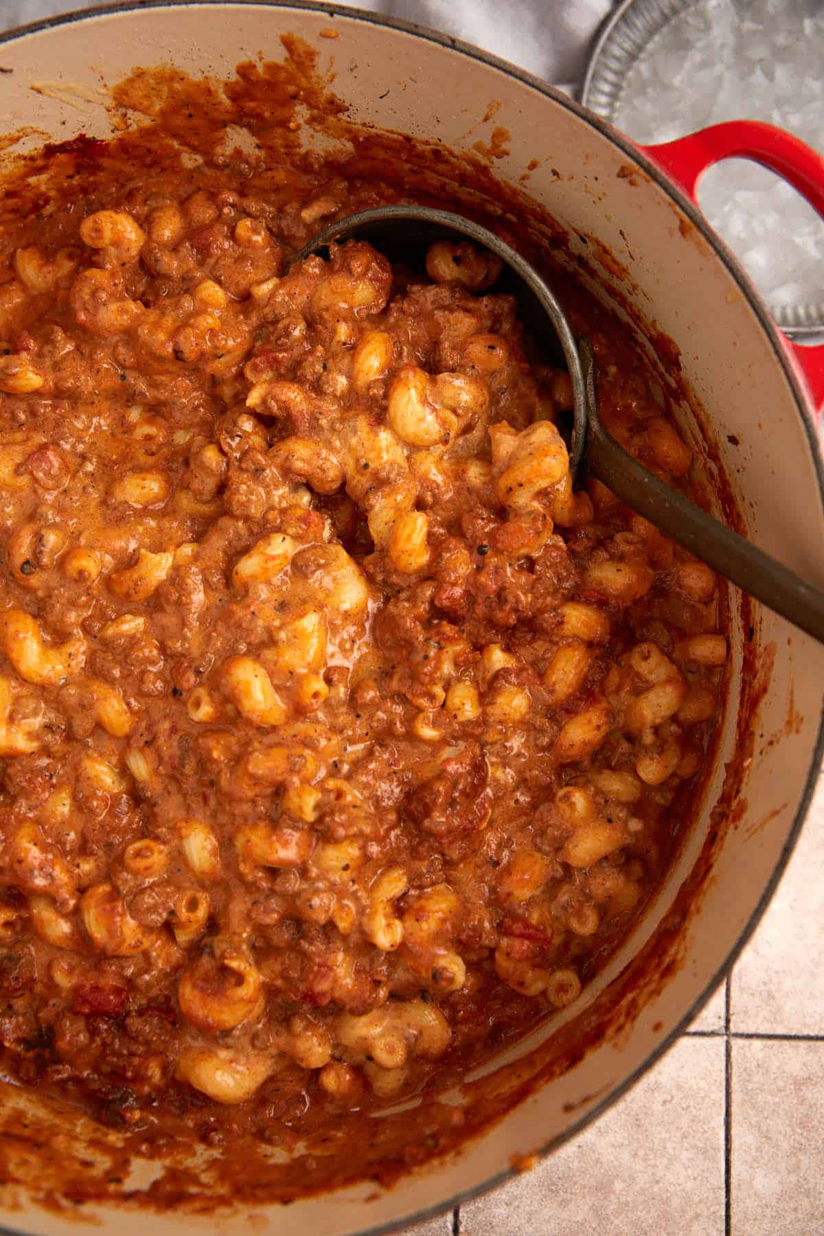 A pot of mac and cheese with chili.
