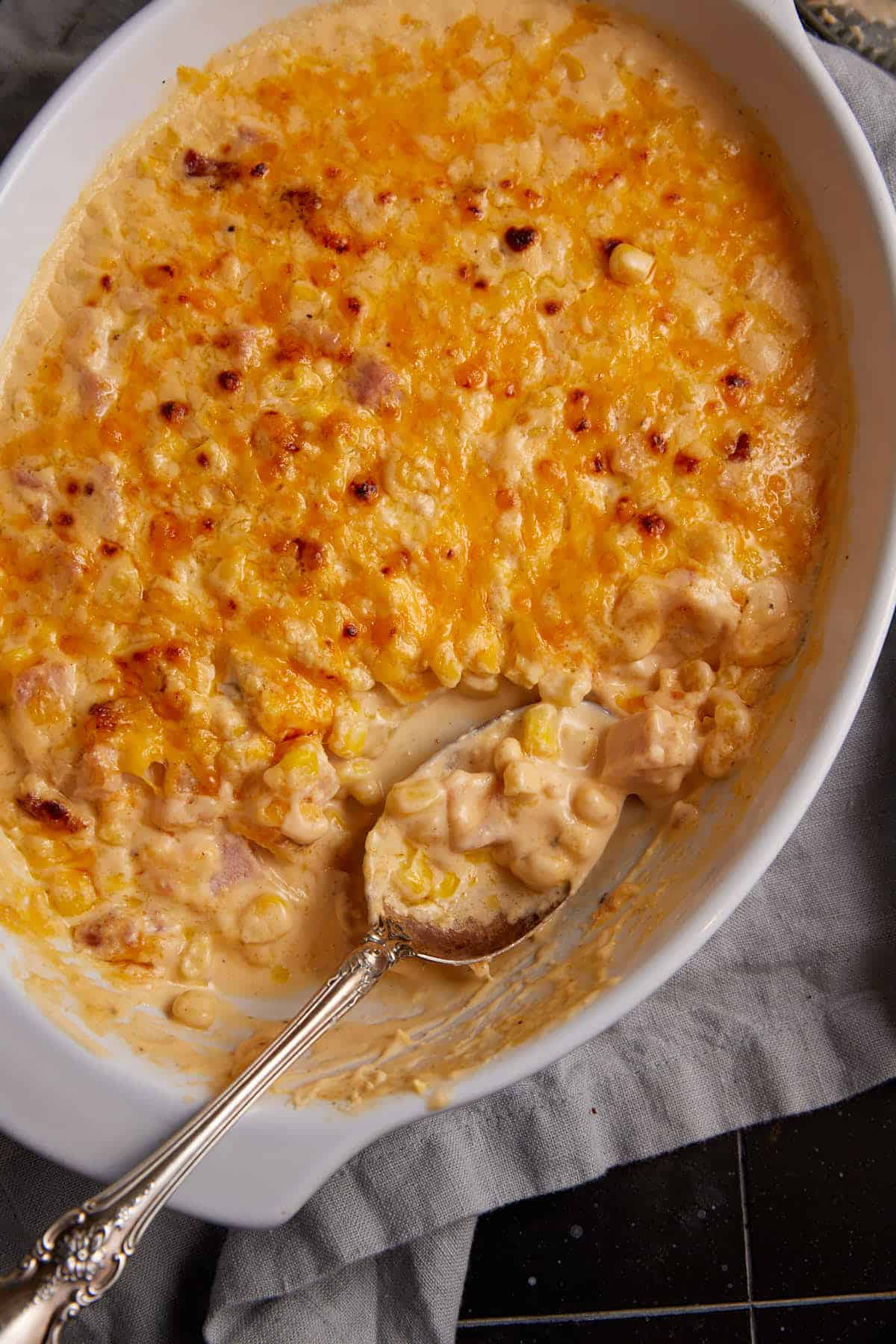 A baking dish of creamy corn casserole.