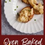 A white plate with crostini and crab dip.