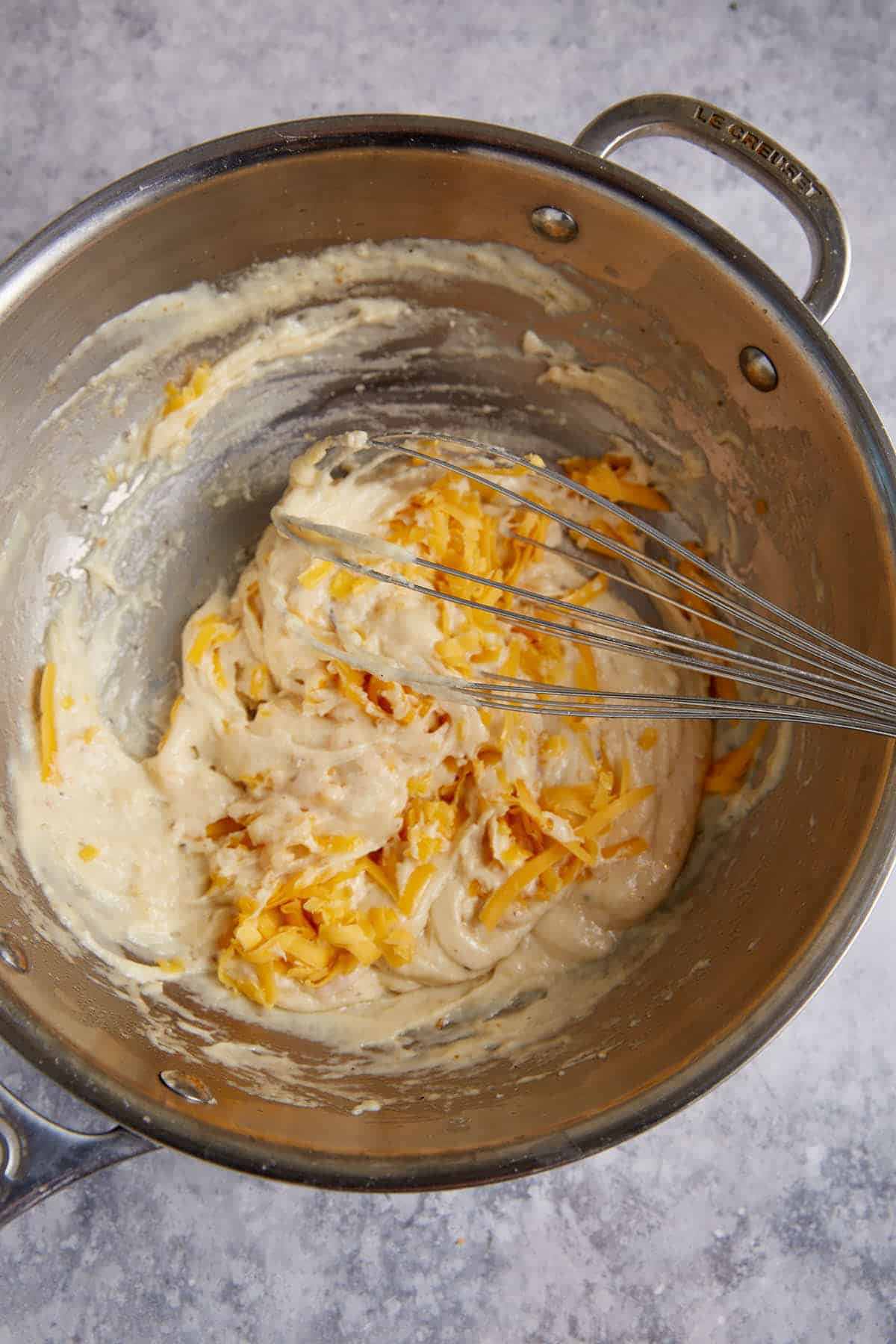 Cheese being mixed into the crab dip.