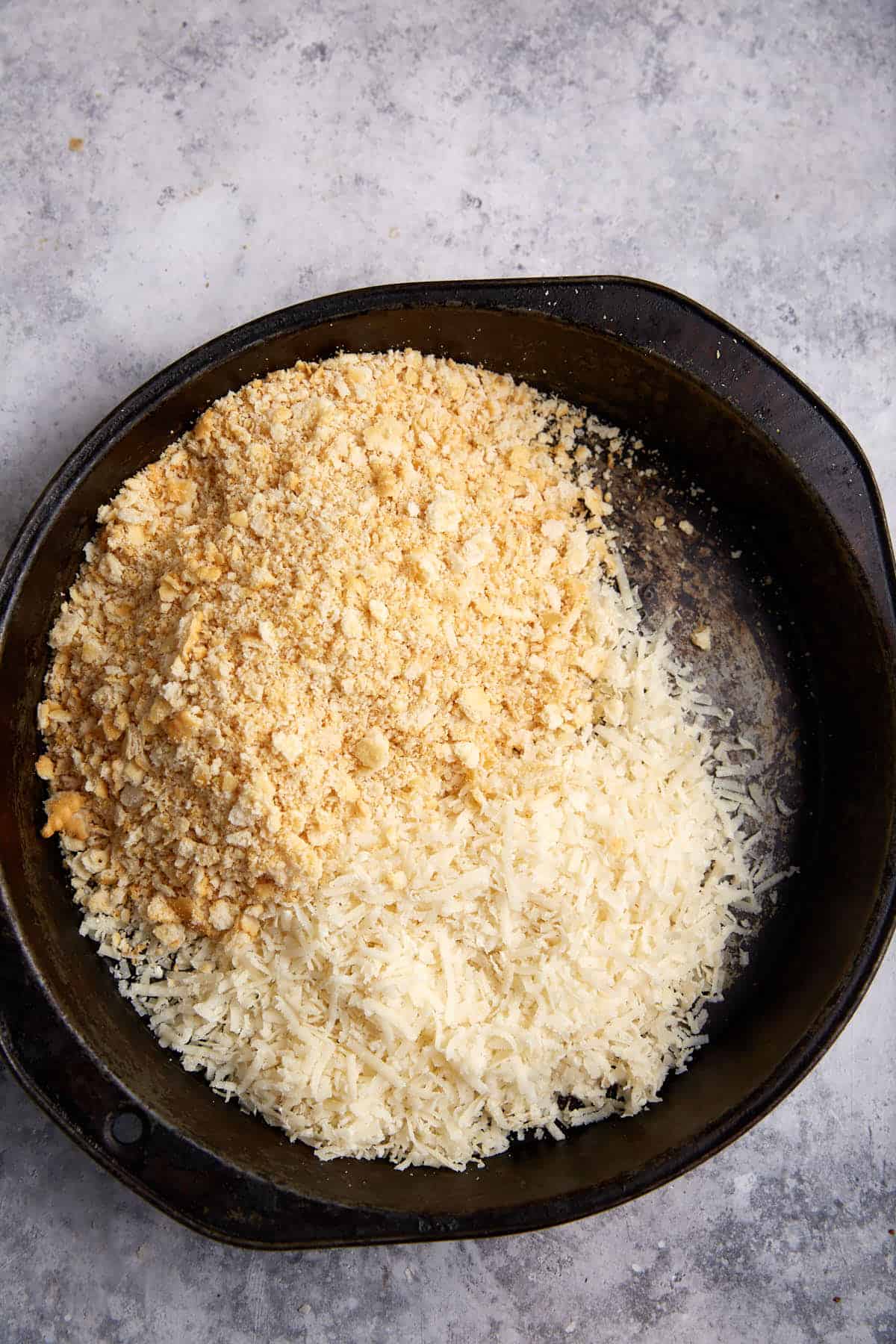 Crackers and cheese in a cake pan.