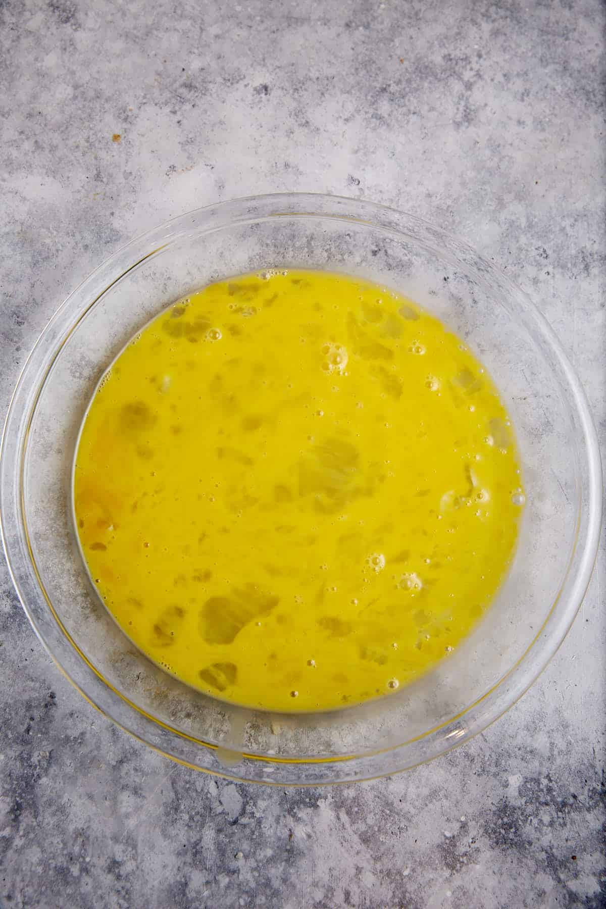 Beaten eggs in a bowl.