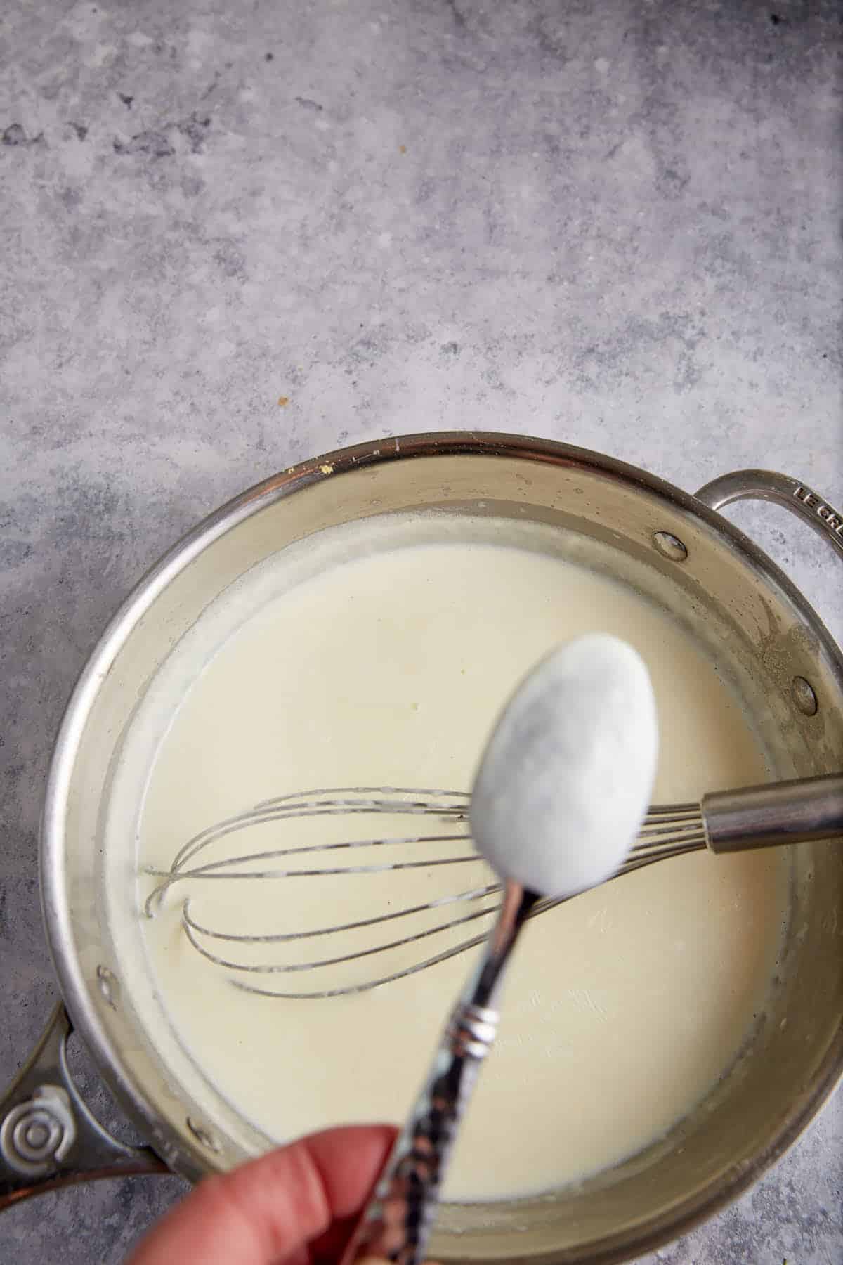 The back of a spoon coated with sauce.