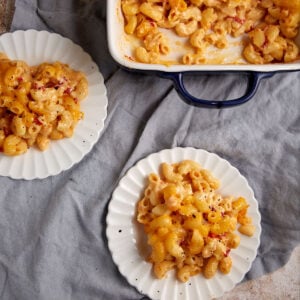 Two plates with servings of Southern mac and cheese.
