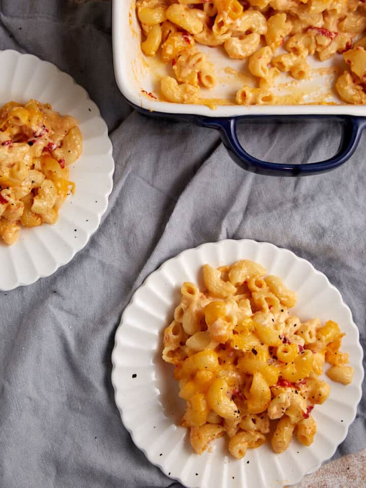 Two plates with servings of Southern mac and cheese.