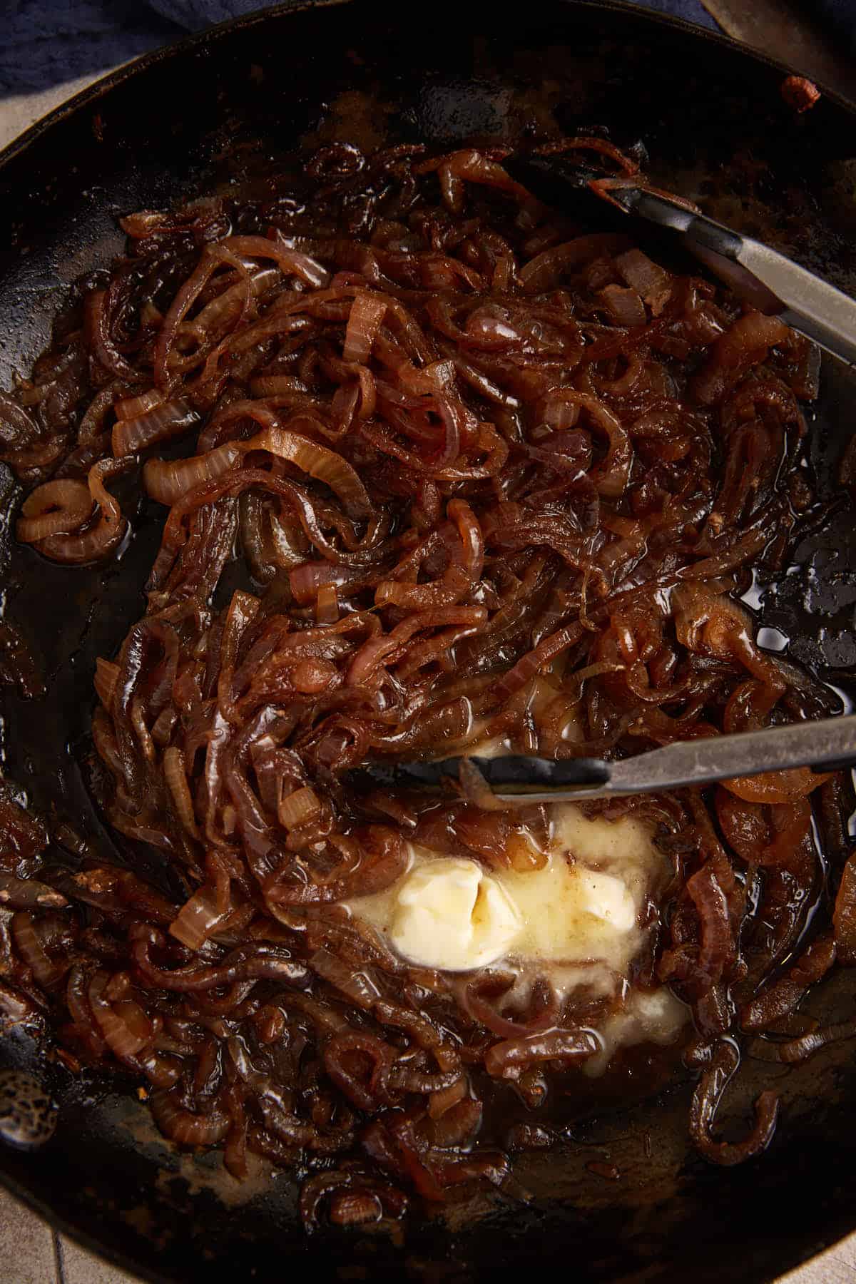 Caramelized onions in a skillet with some butter.