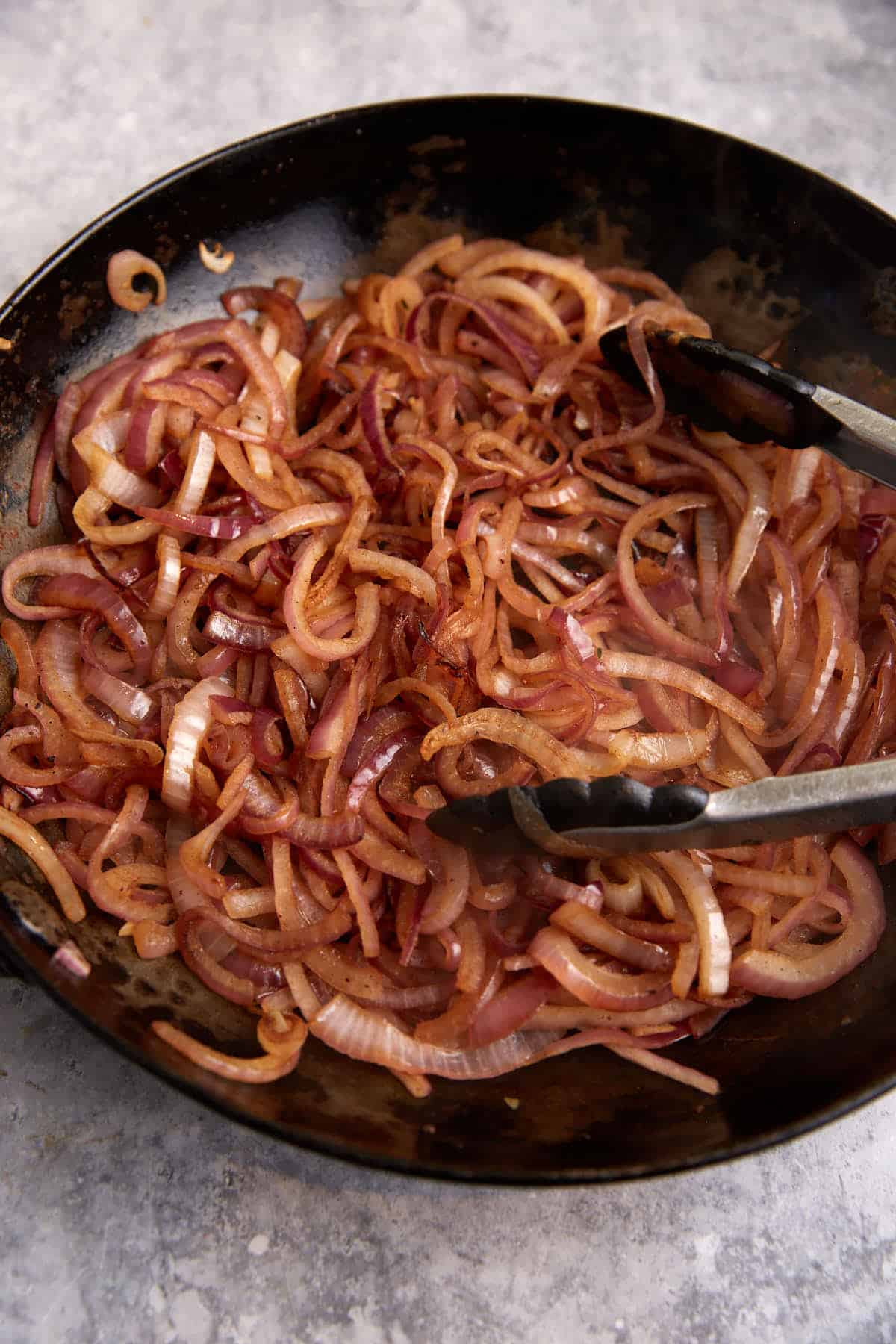 Onions cooked in a skillet.