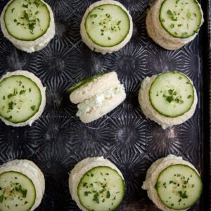 Rows of cucumber sandwiches cut into circles.