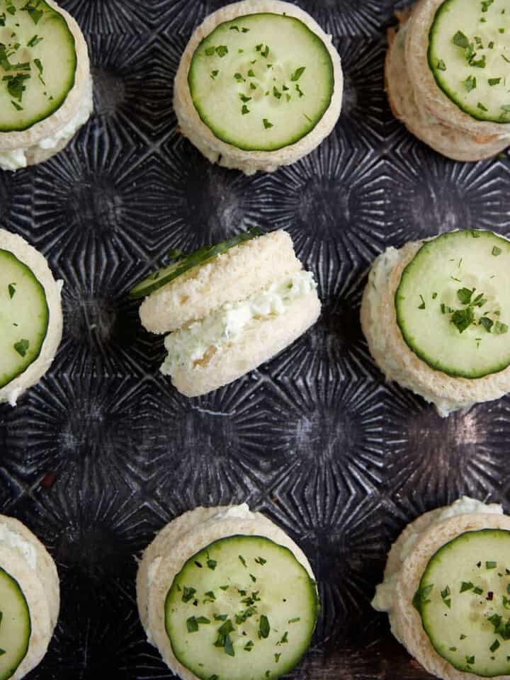 Rows of cucumber sandwiches cut into circles.