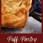 Puff pastry chicken pie in an iron skillet.