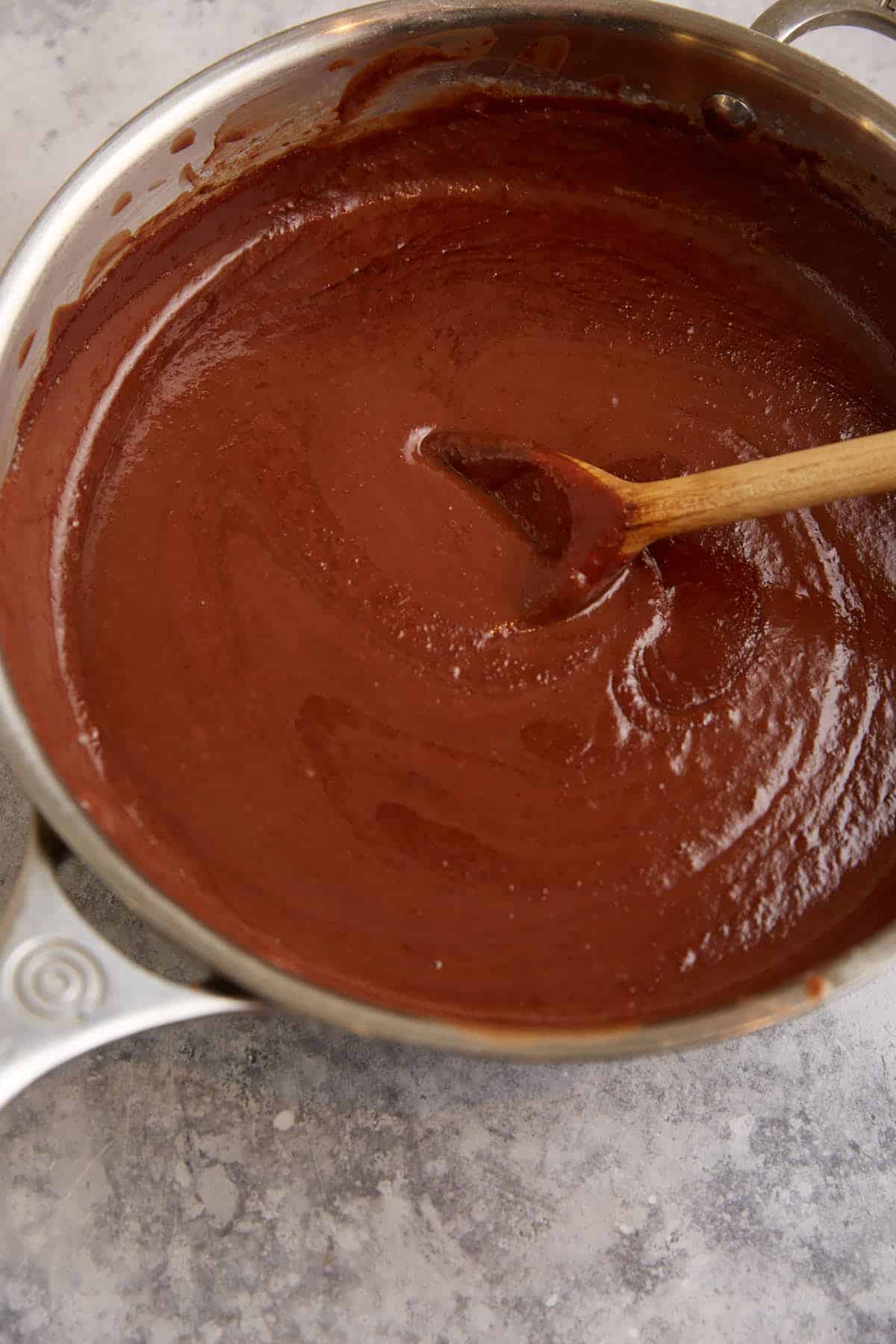 Pudding cooking in a saucepan.