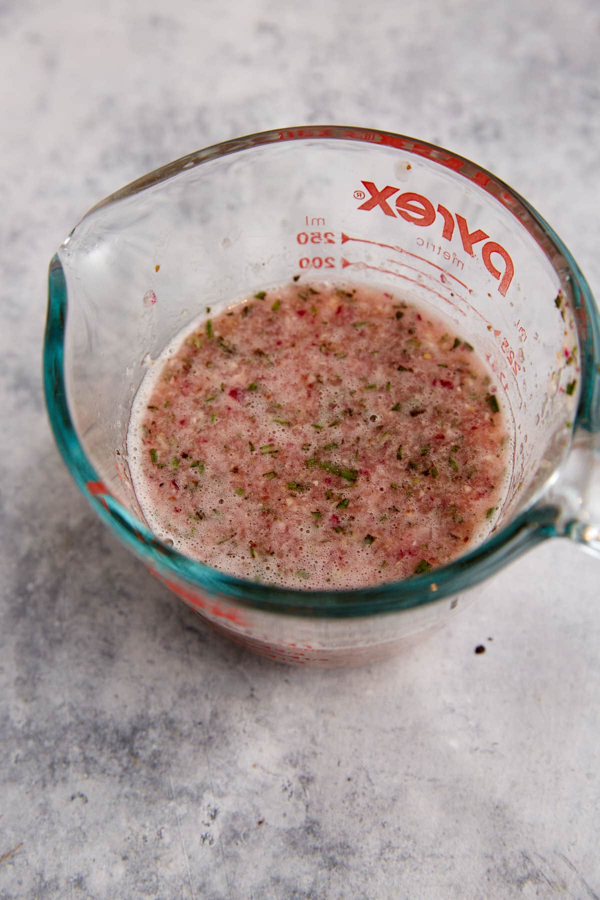 A bowl of salad dressinsg.