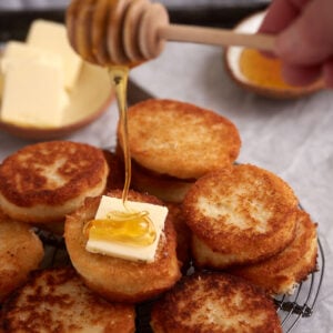 Honey dripping onto hot water cornbread.