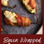 Bacon wrapped jalapeno poppers on a platter.