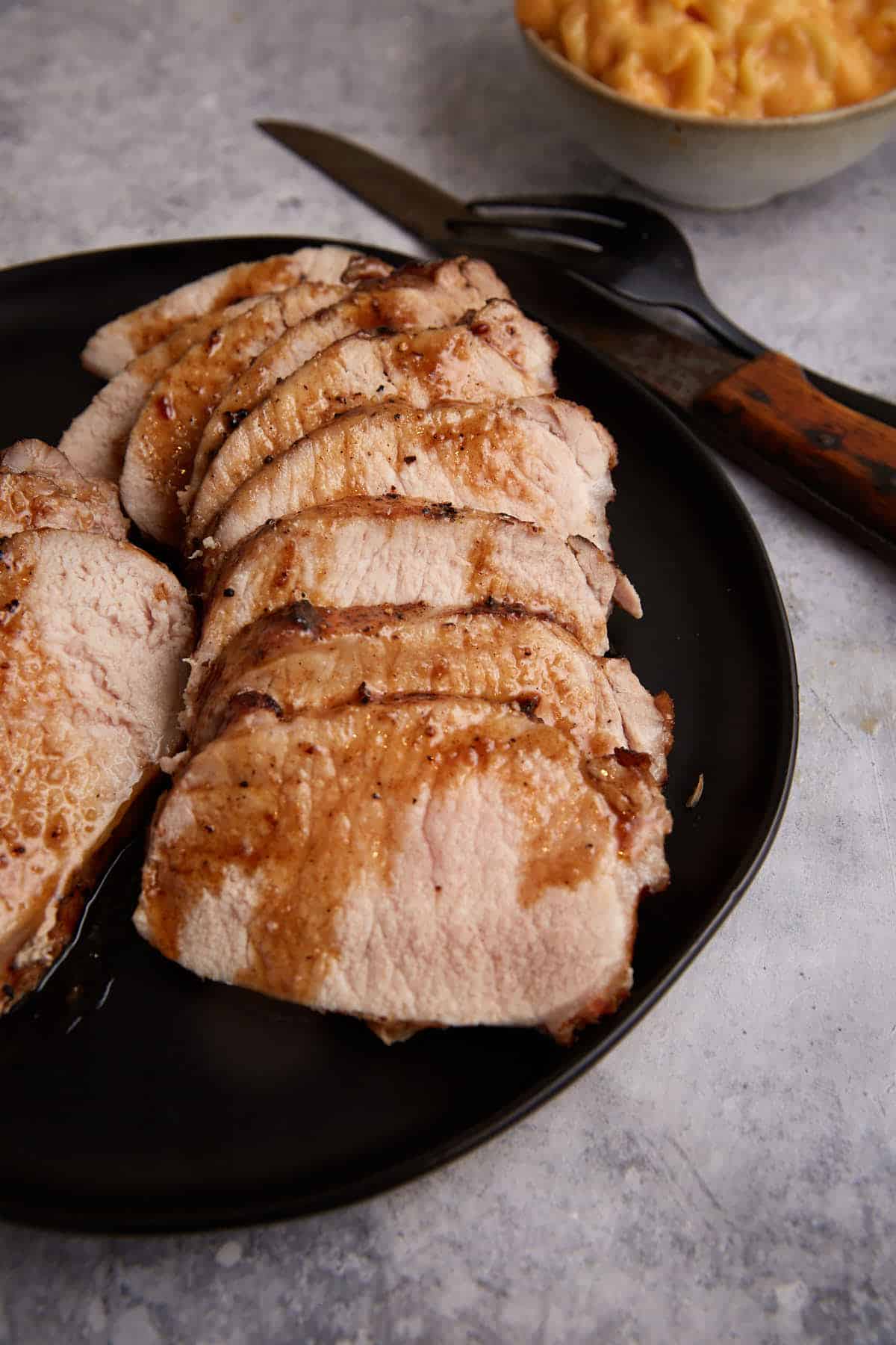 A sliced pork roast on a platter.