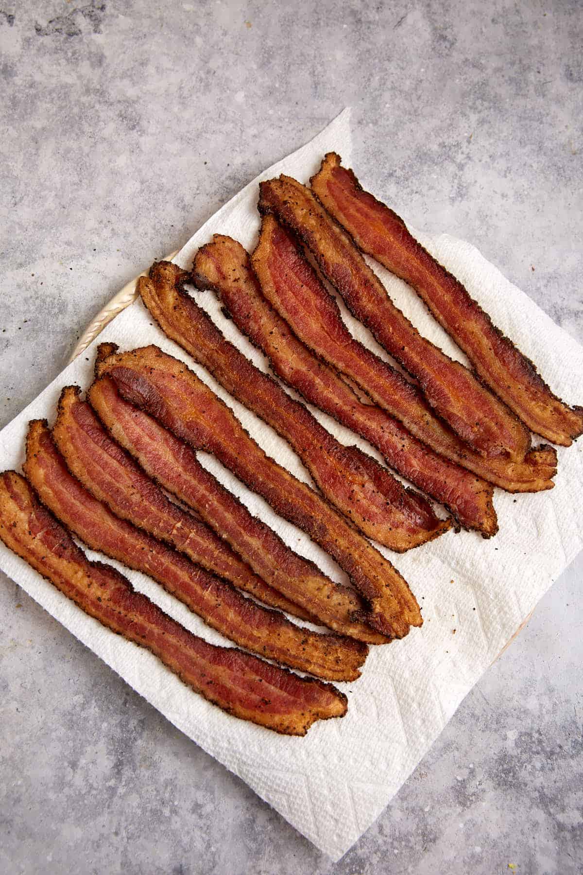 Cooked bacon on a plate.