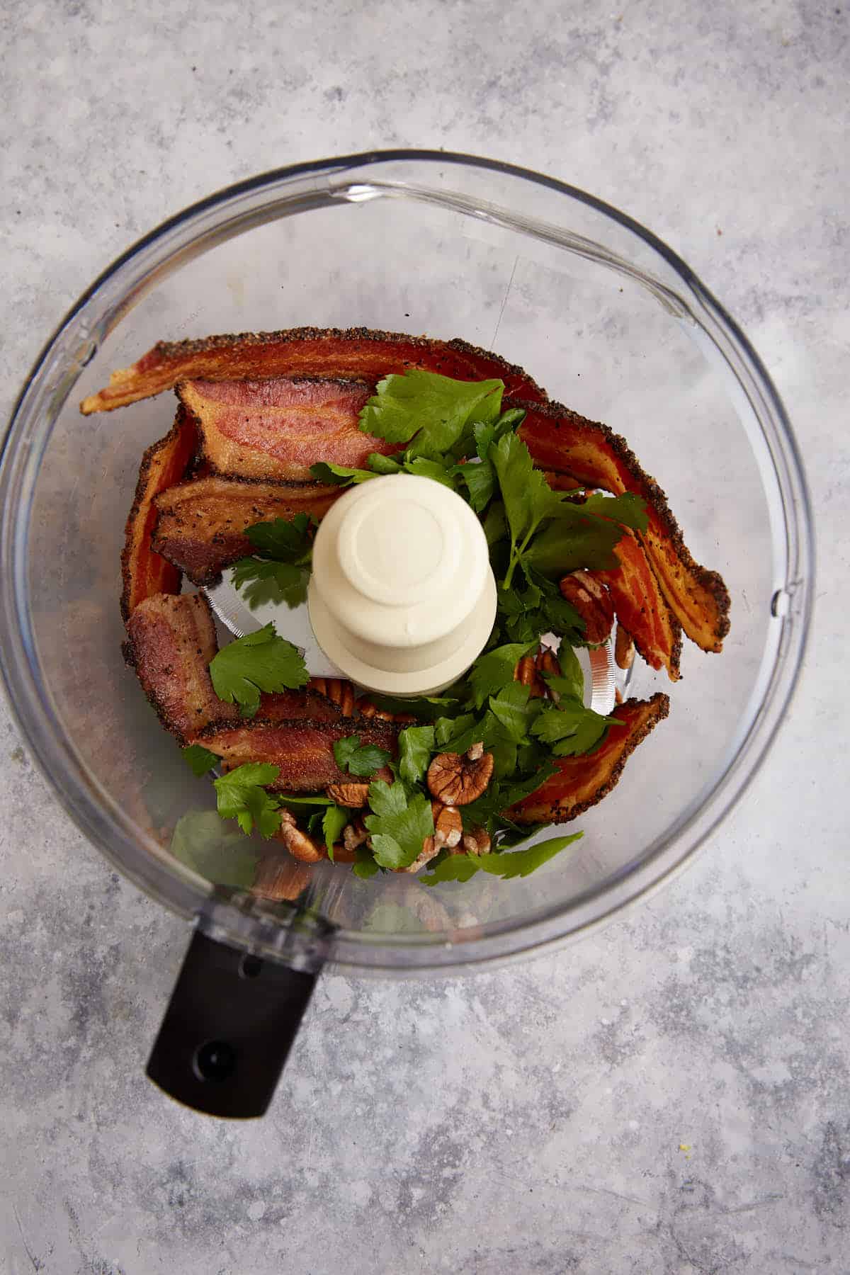 Bacon, parsley and pecans in a food processor.