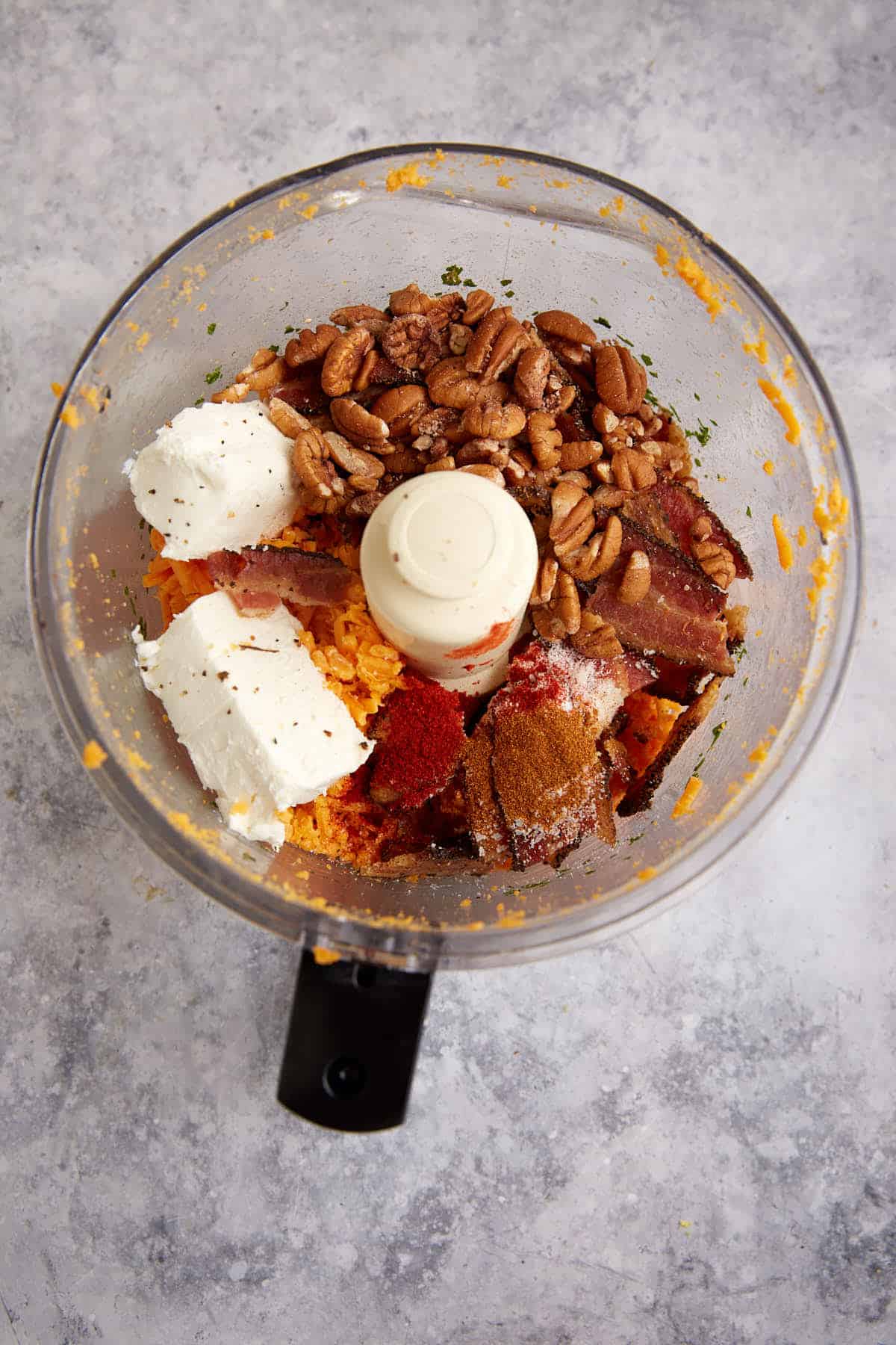 Cheese, cream cheese and bacon in a food processor.