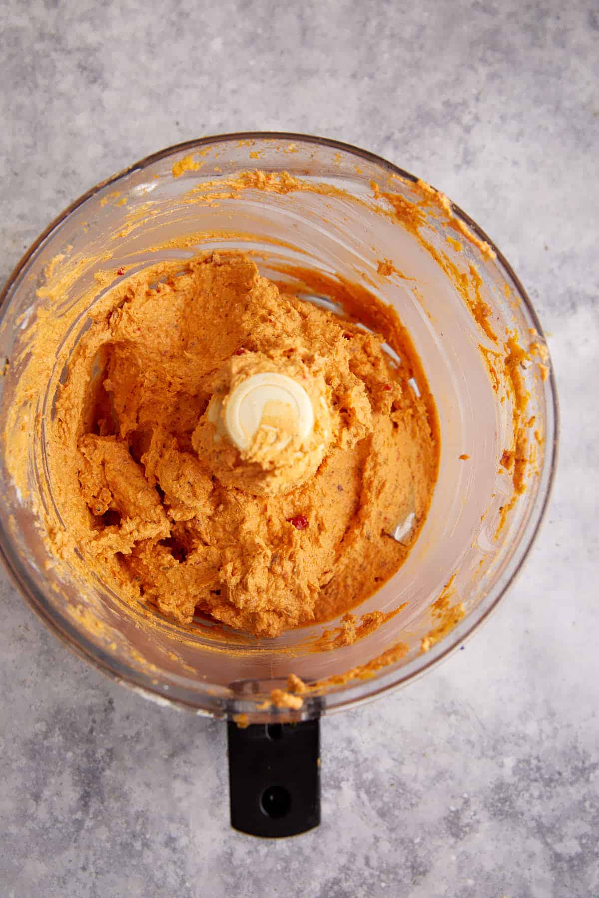 The cream cheese mixture in a food processor.