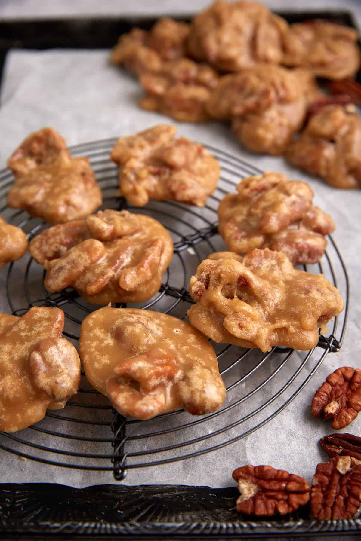 A rack of cooled praline pecans.