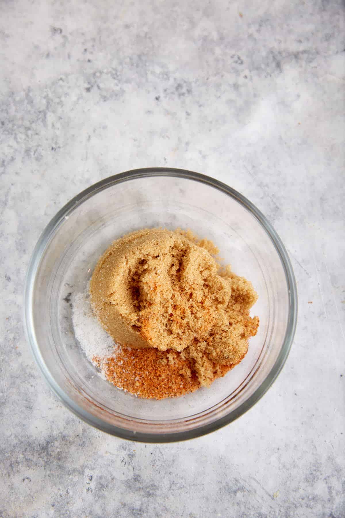 A bowl of brown sugar and seasoning.