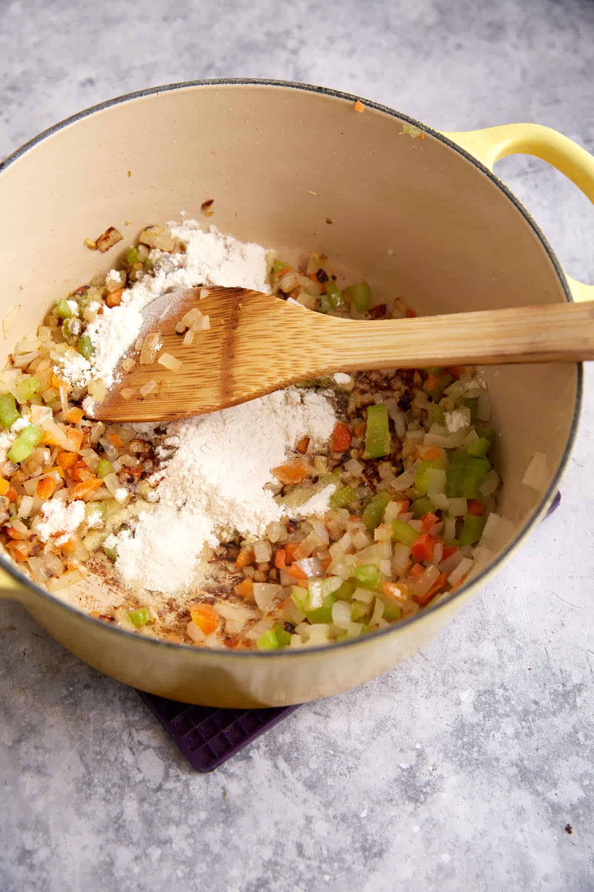Flour added to onions, carrots and celery.