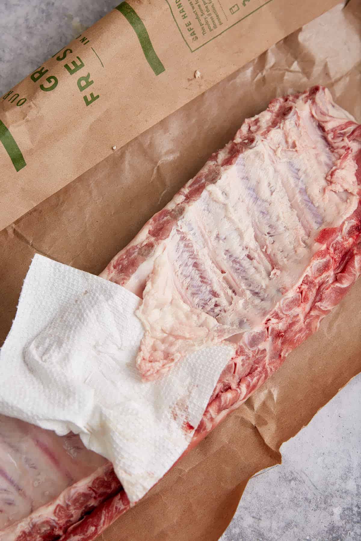 The membrane being removed from ribs.