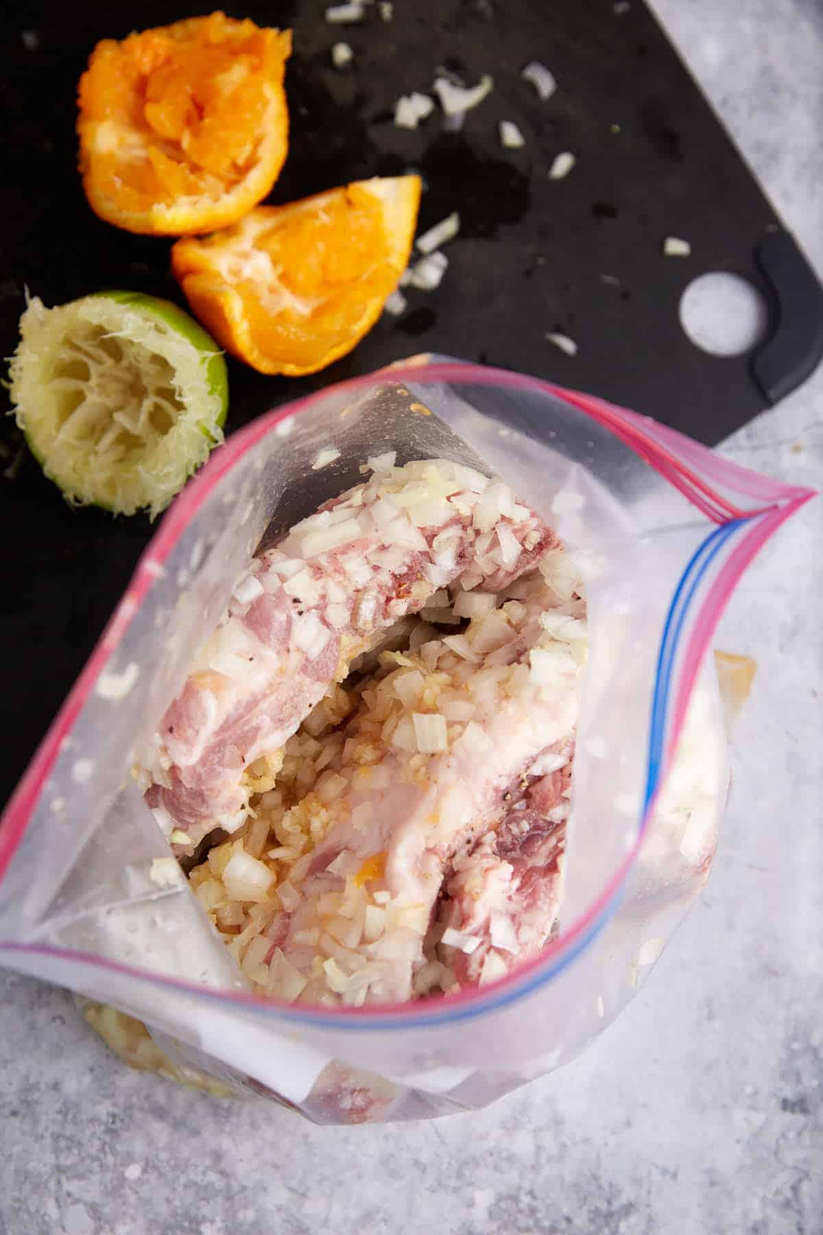 Pork ribs marinating in a ziplock.