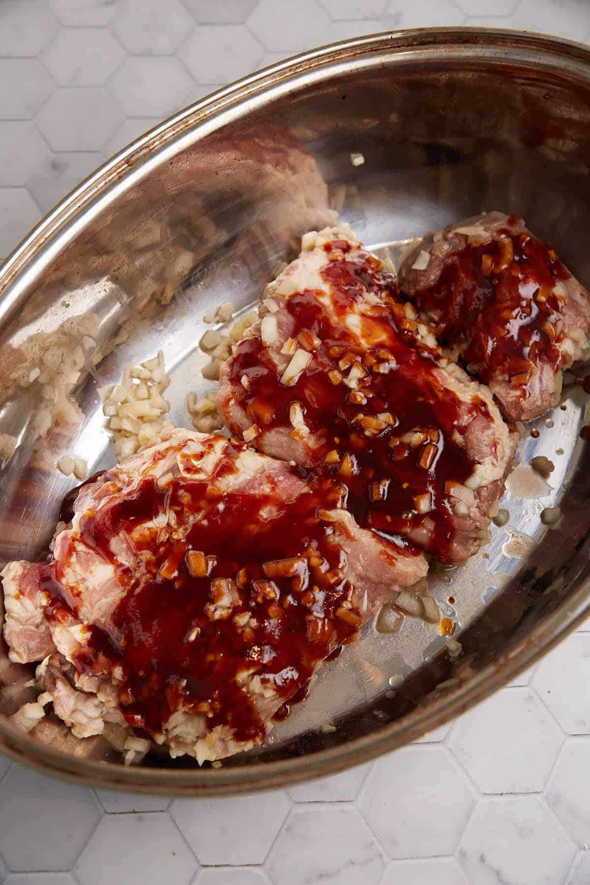 Pork ribs before they have cooked in a roaster.