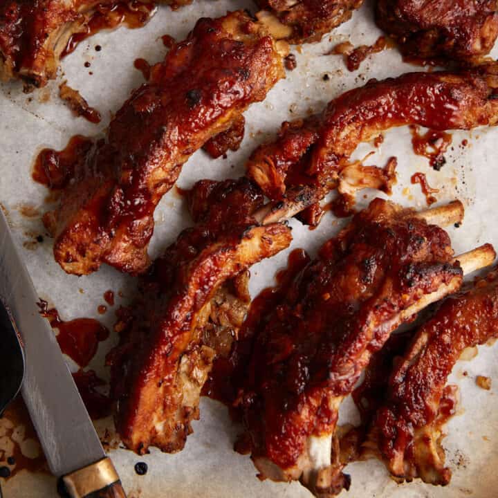 Ribs covered in BBQ sauce.