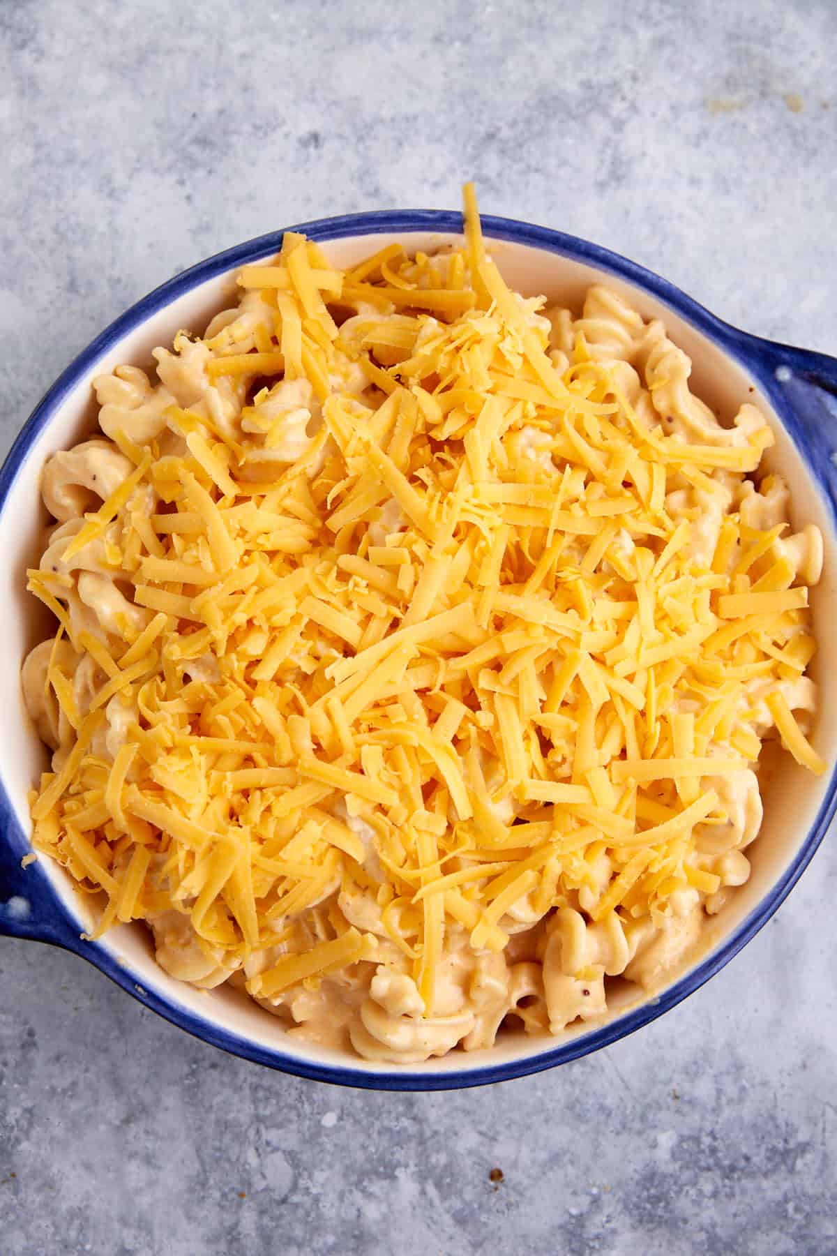 A casserole dish of mac and cheese with chicken.