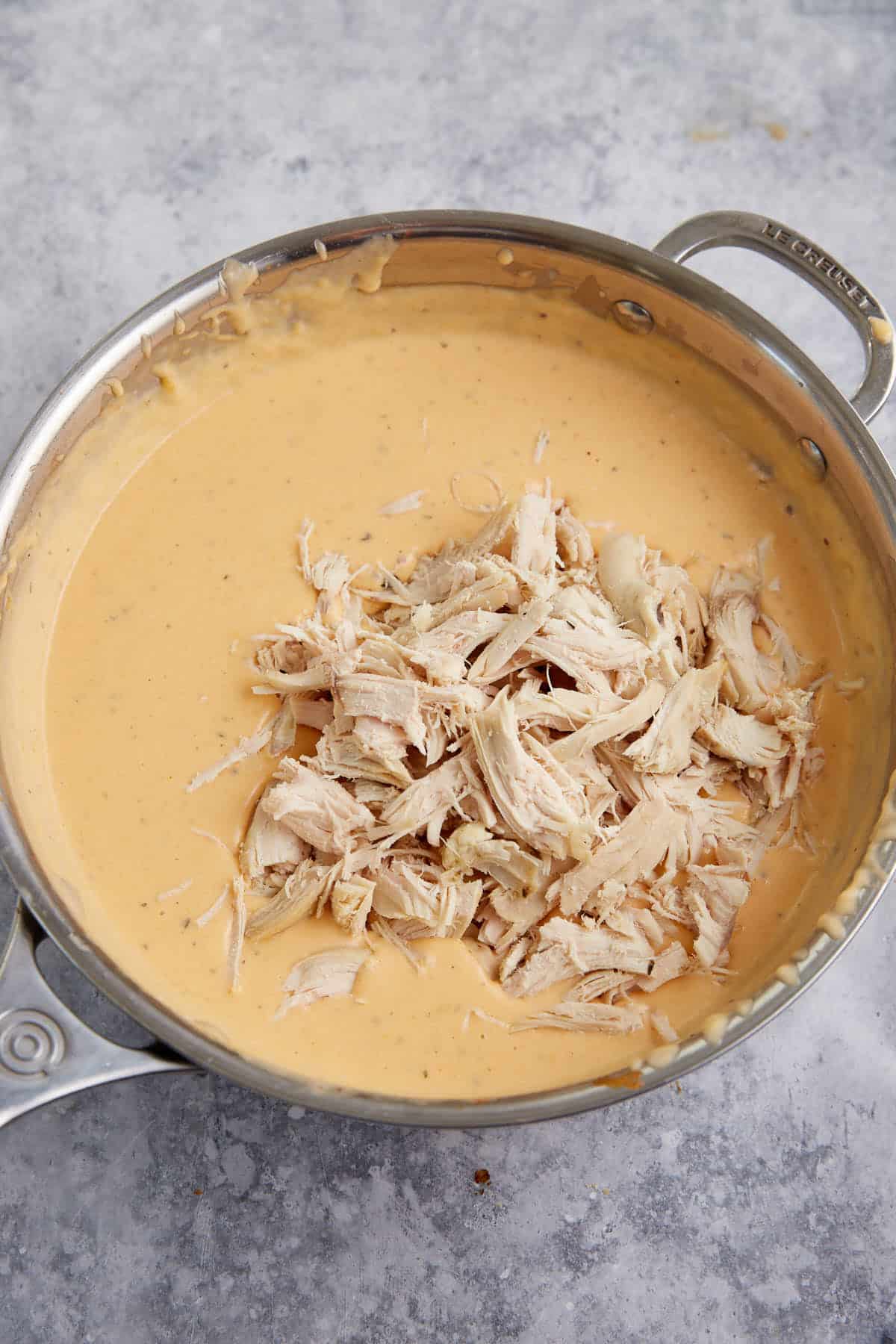 Chicken added to a buffalo cheese sauce.