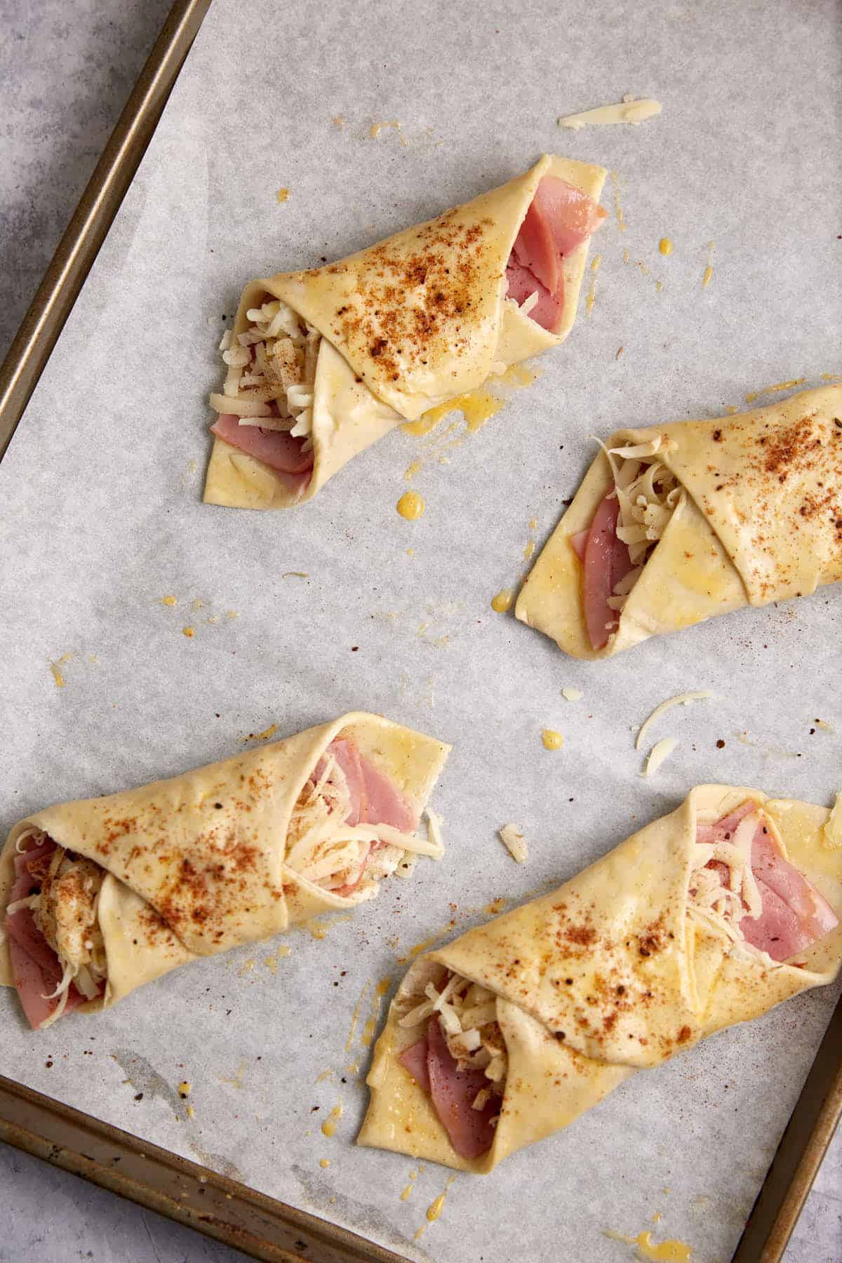 Breakfast puff pastries before they have baked.