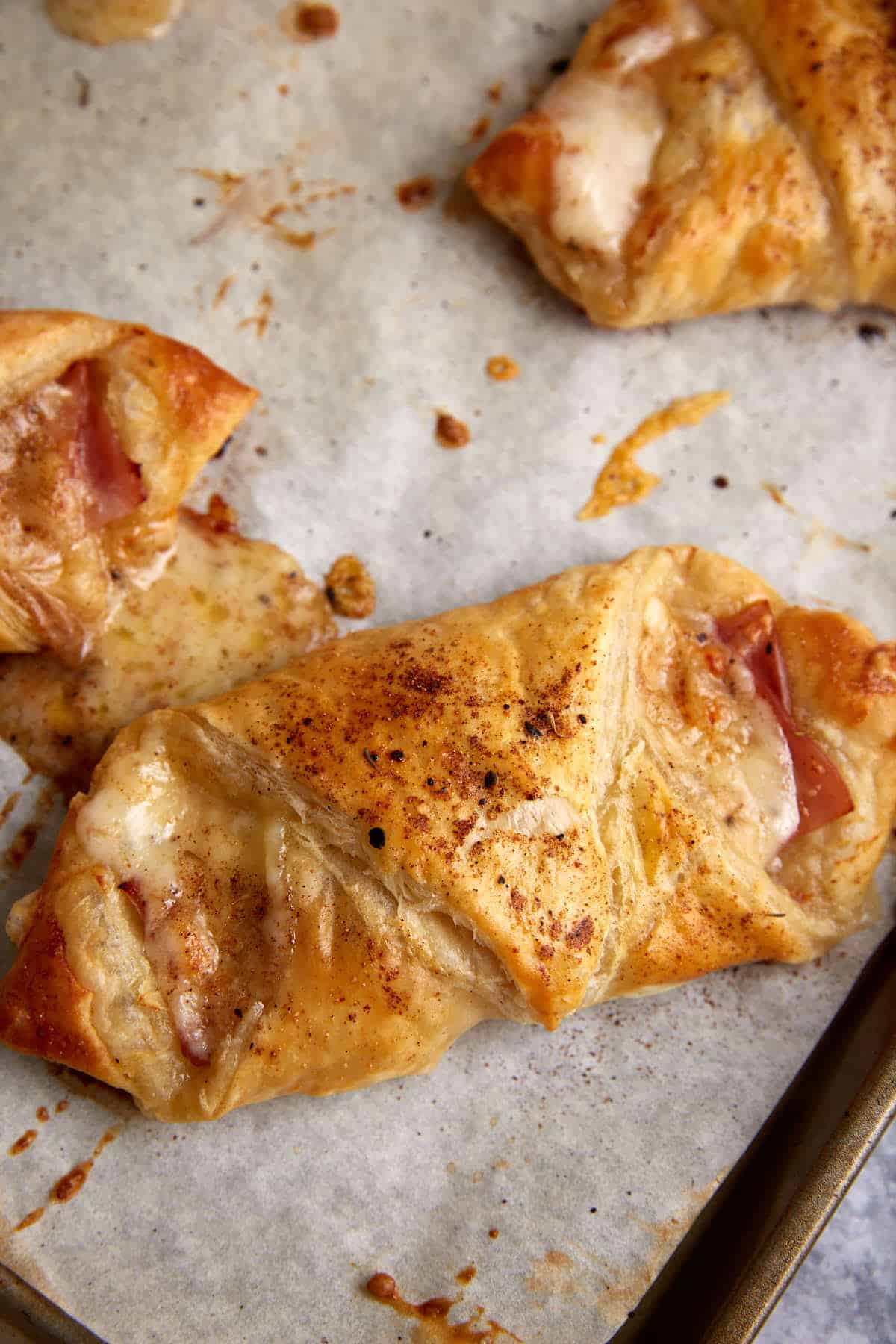 Breakfast puff pastries on parchment paper.
