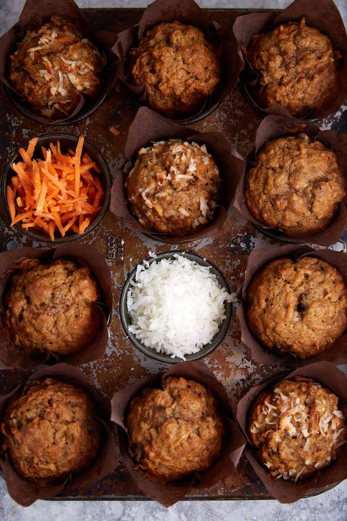 A muffin tin of baked morning glory muffins.