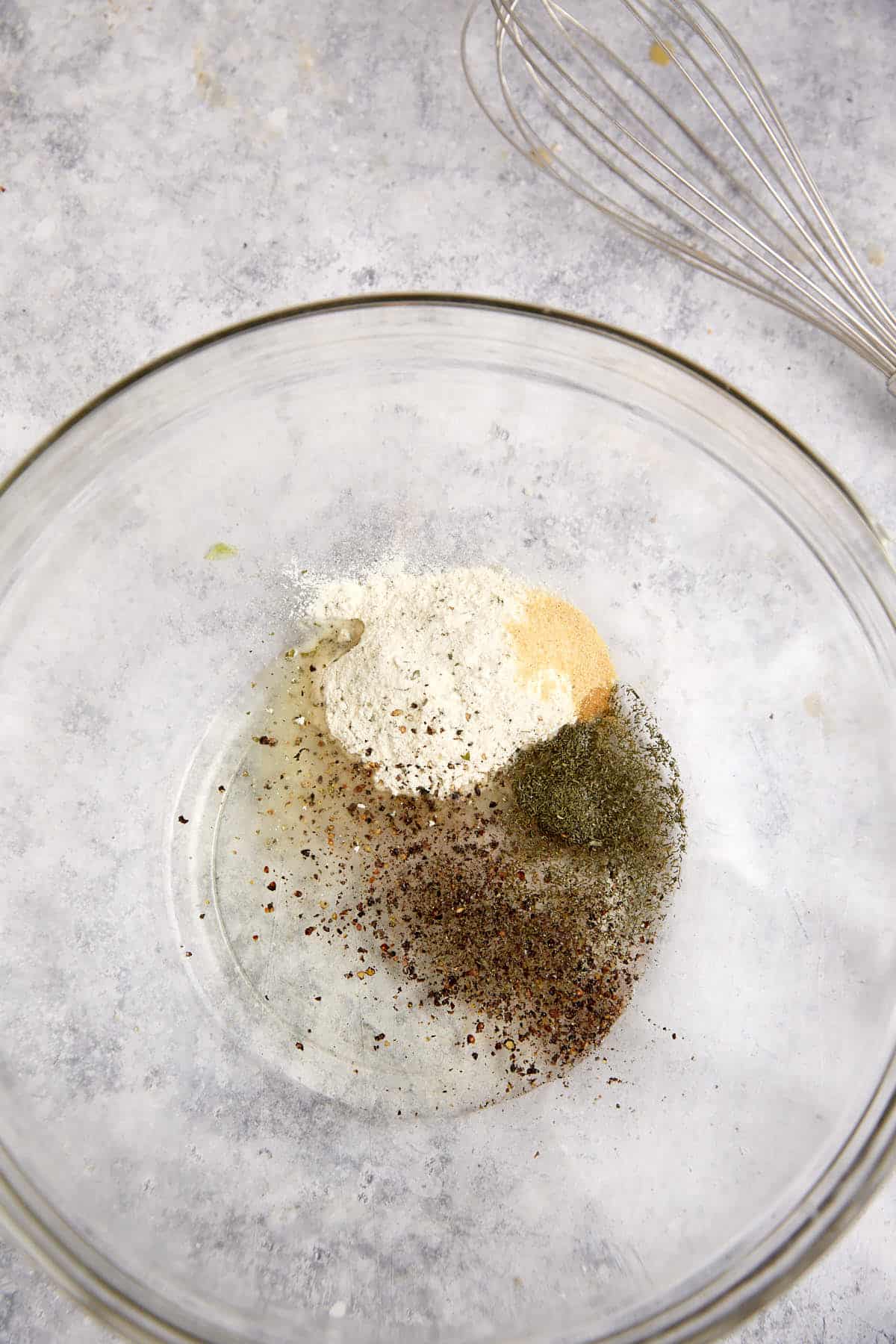 A bowl of the seasoning for ranch oyster crackers.