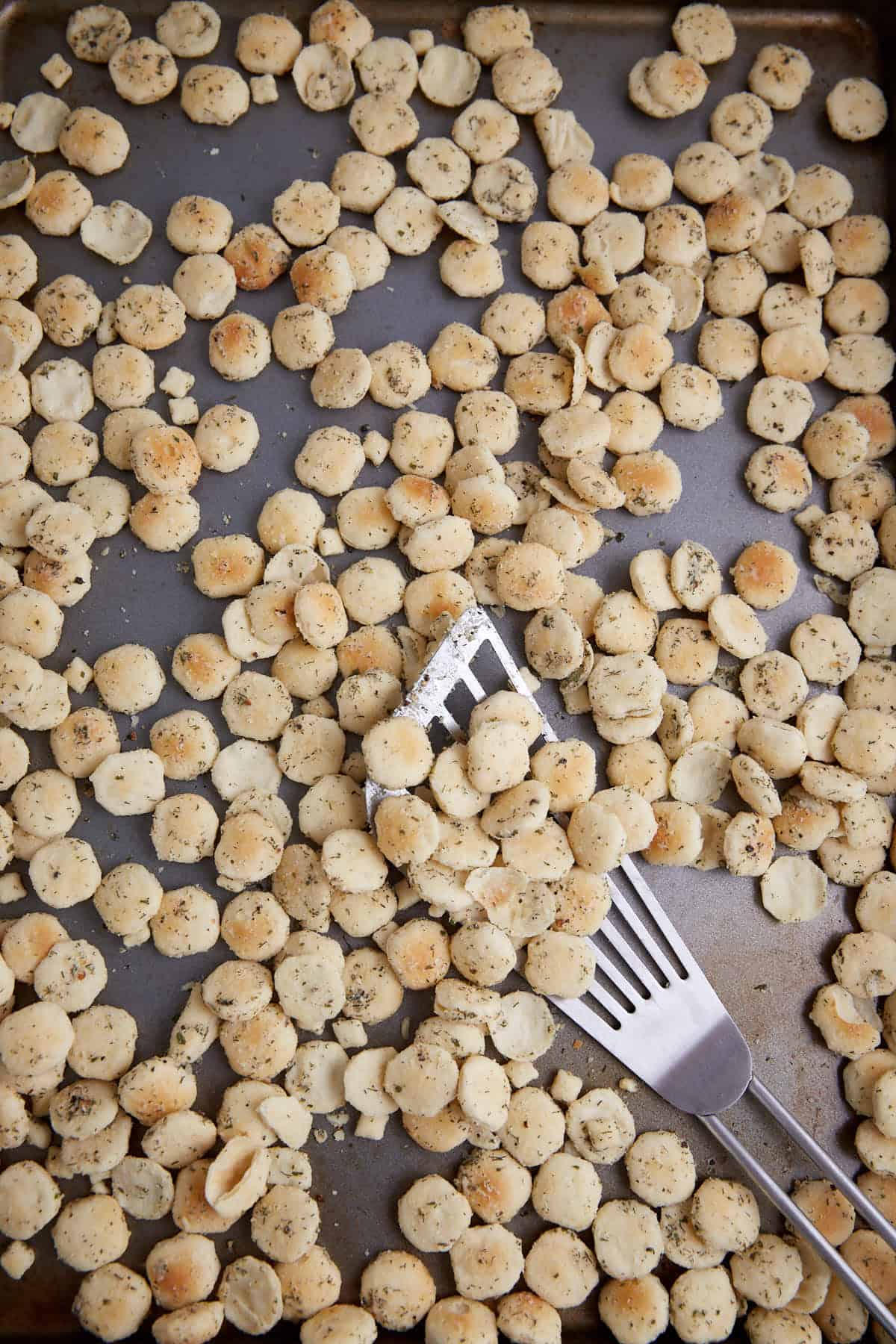 Baked oyster crackers on a baking sheet.