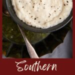 A bowl of white country milk gravy.