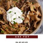 A serving dish of beef stroganoff with sour cream.