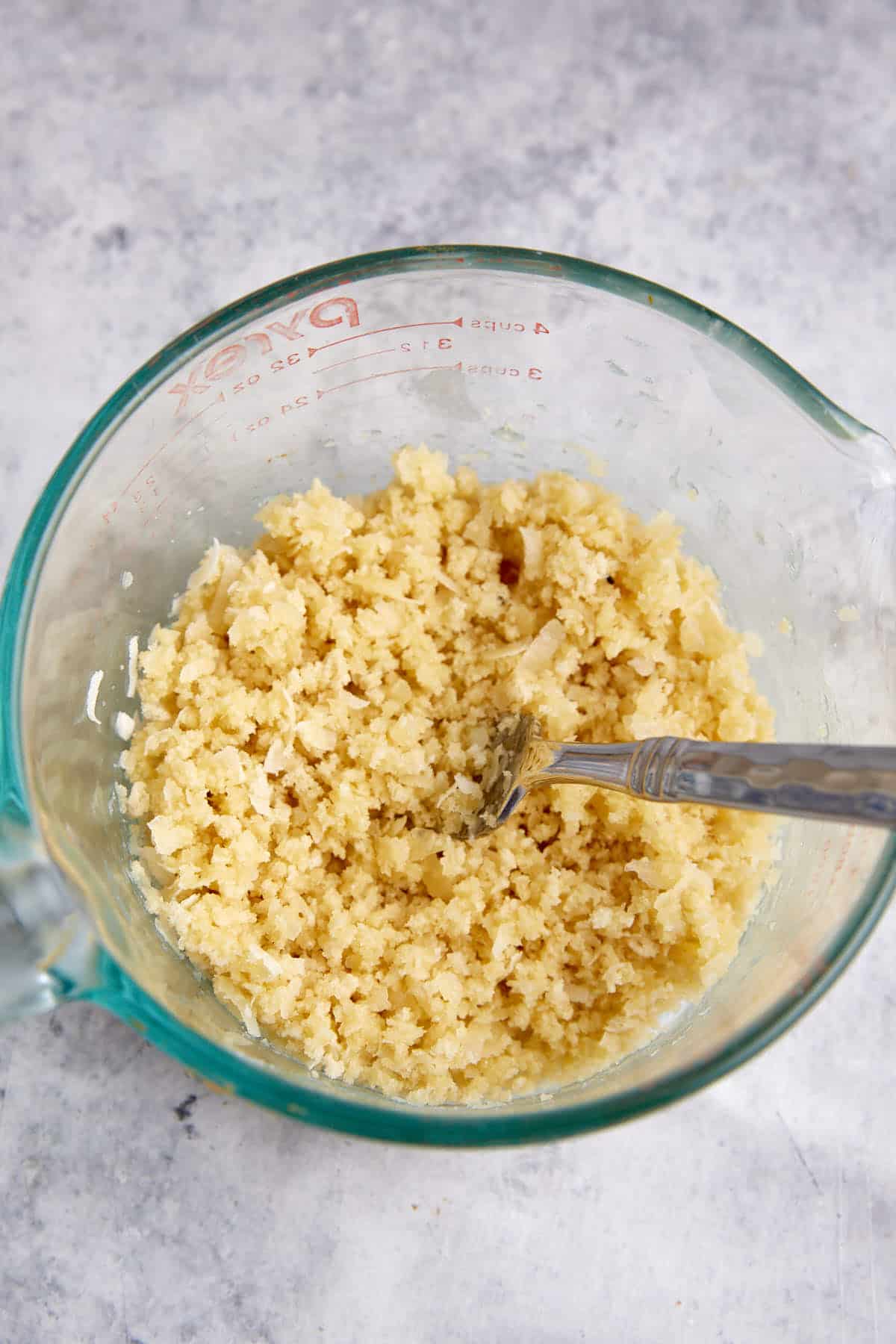 A bowl of panko and parmesan cheese topping.