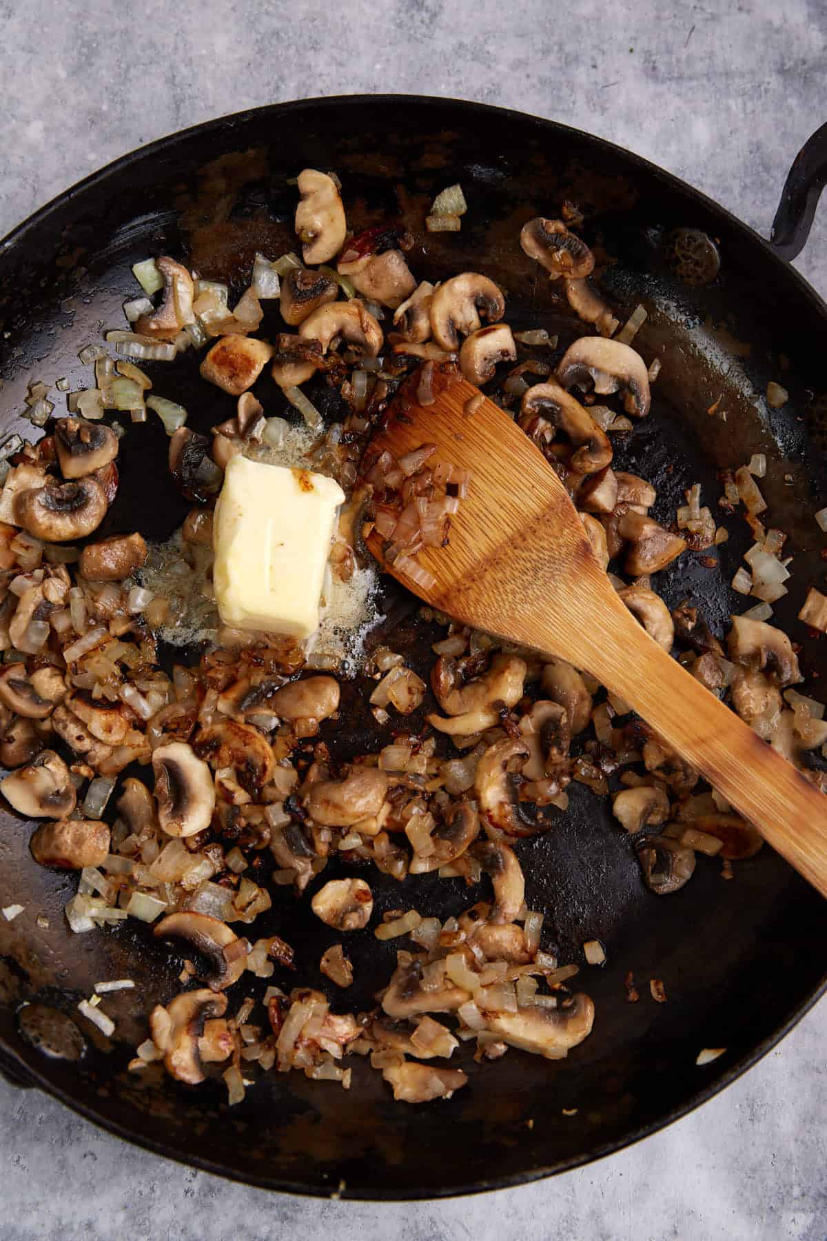 Butter added to the mushrooms and onions.