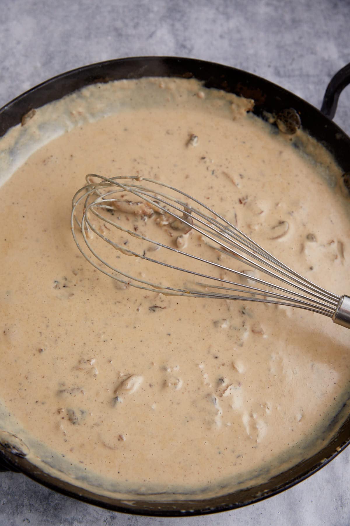 Milk added to mushrooms and onions.