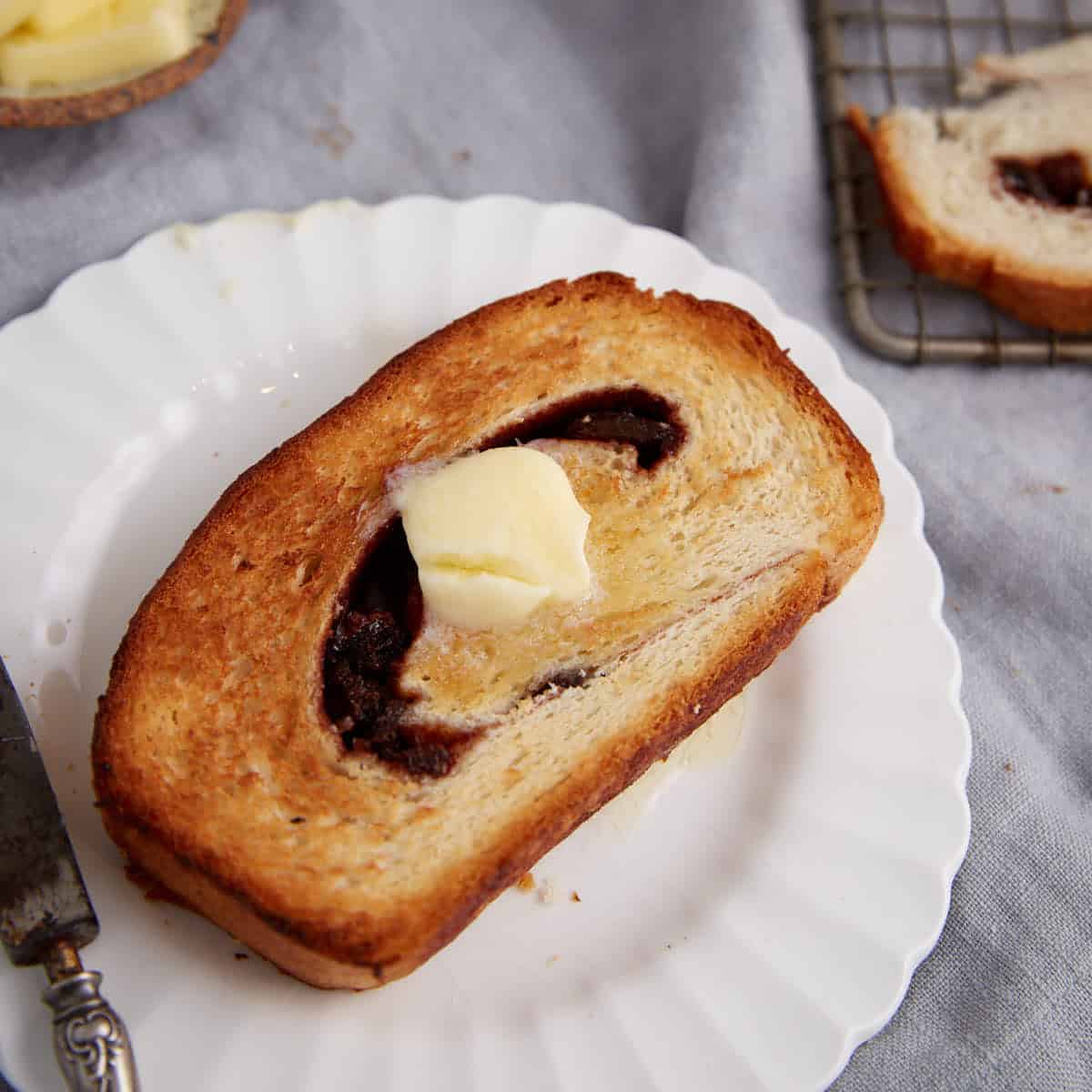 A slice of toasted cinnamon raisin bread.