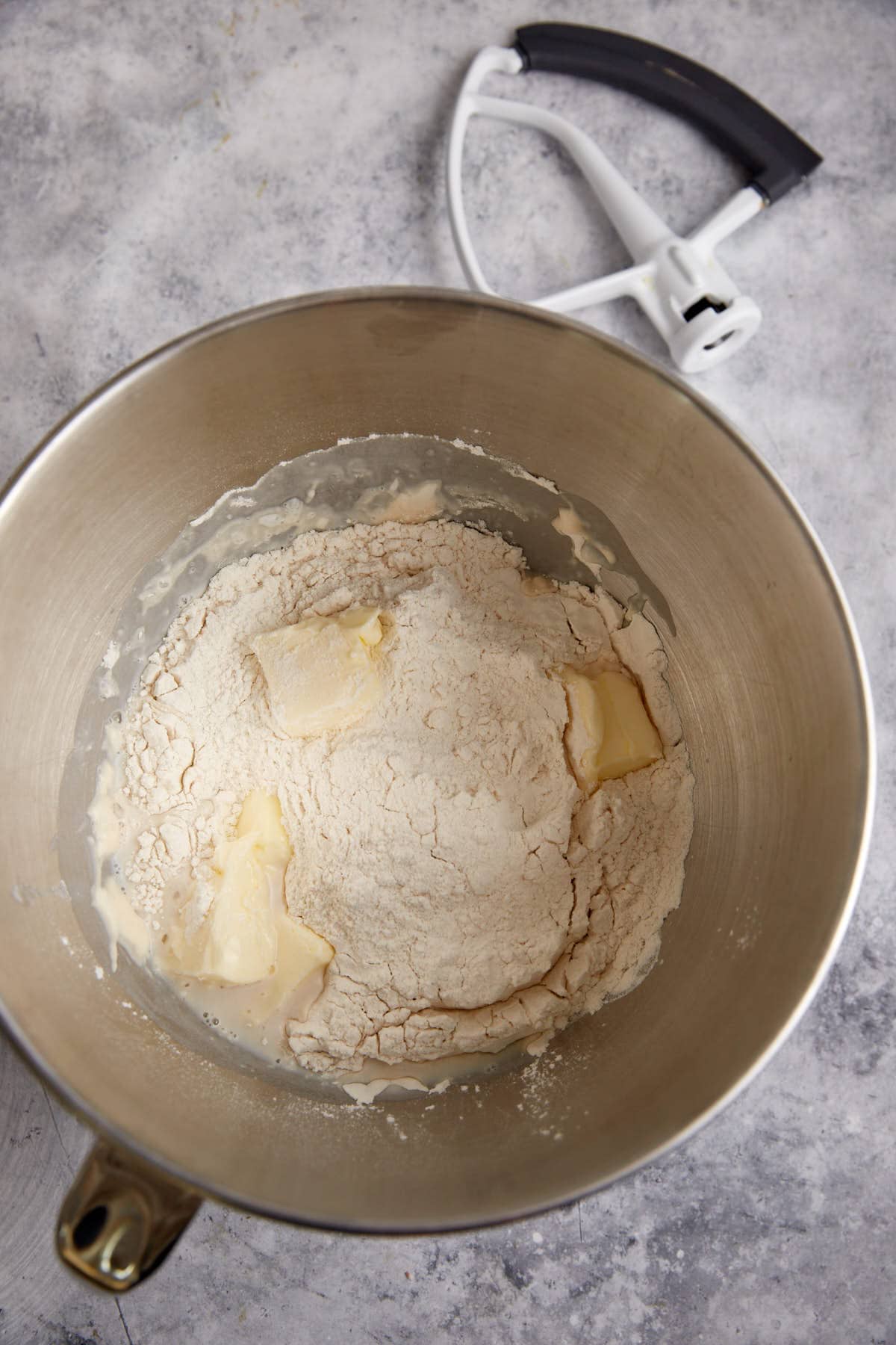 The ingredients for a yeast dough in a stand mixer.